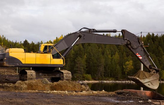 Crawler excavator working on the roadside