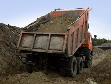 Tipper dumping gravel  for road construction