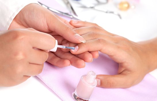 Manicure. Care of fingers of hands, cleaning, covering a varnish of nails.