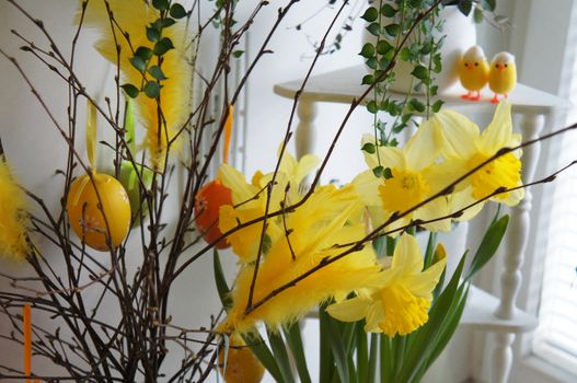 Easter lilies, Easter eggs, feathers and other decorations for Easter