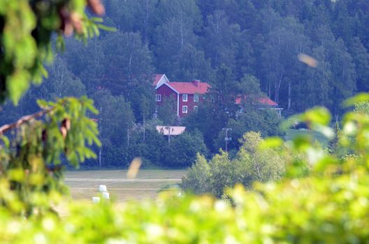 View over the countryside and a Red House