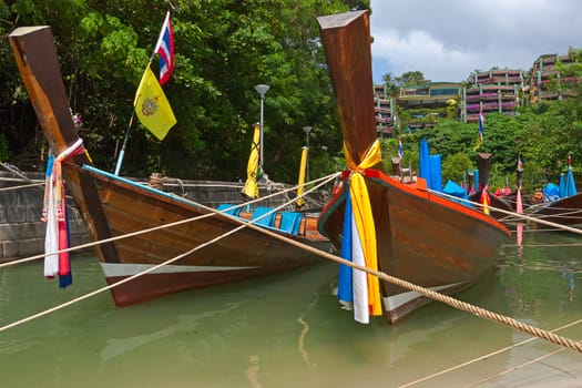 Boats on  shore waiting for tourists, Thailand.