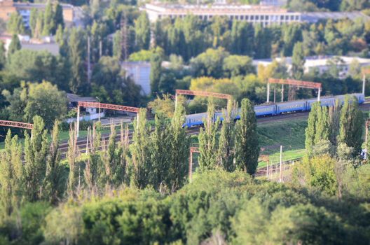 Blue train near green park at Kiev, Ukraine