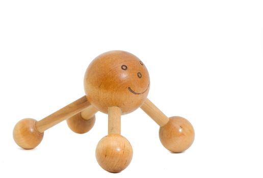 a smiley wooden massager for the back