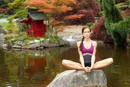 A woman practices Yoga in a beautiful place