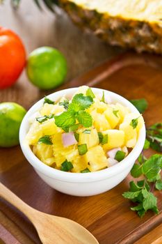 Pineapple salsa salad by fresh tomato,mint and pineapple