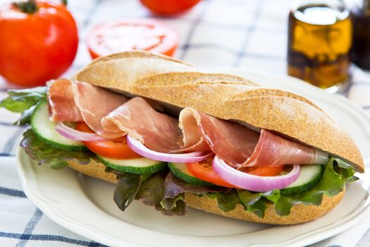 Prosciutto sandwich by fresh tomato and pepper