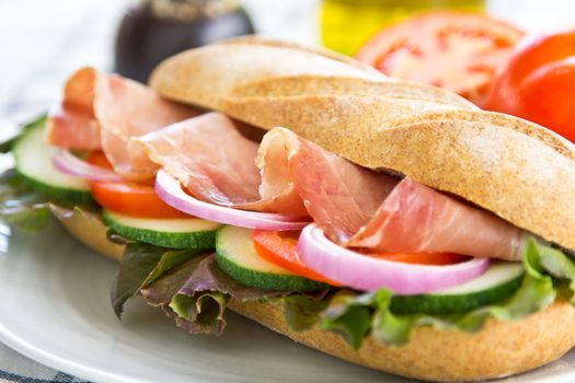 Prosciutto sandwich by fresh tomato and pepper