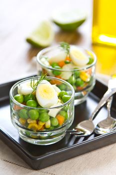 Qail egg with pea,corn and carrot salad