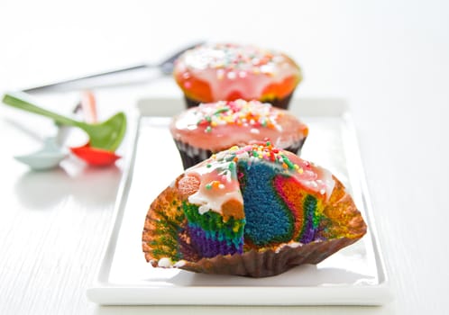 Colourful Rainbow cupcake with sugar on top