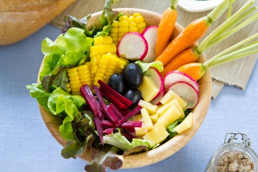 Sweetcorn with lettuce,beetroot,radish, cheese ,baby carrot and olive salad