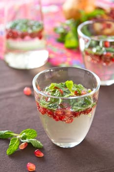 Pomegranate Mojito in glasses and jug