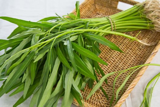 Morning glory vegetable in bamboo basket