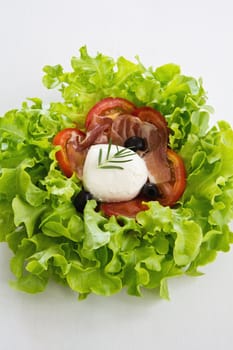 Mozzarella,Prosciutto ,olive ,lettuce and tomato salad