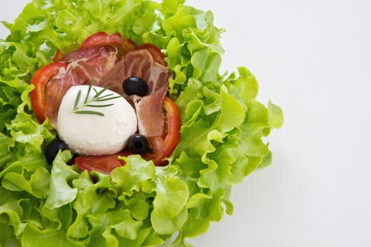 Mozzarella,Prosciutto ,olive ,lettuce and tomato salad