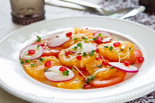 Orange with tomato,radish and pomegranate salad