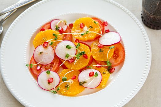 Orange with tomato,radish and pomegranate salad