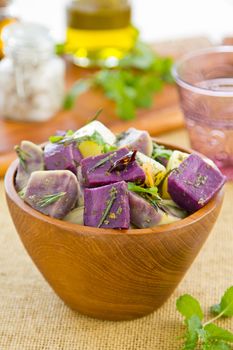 Potato and sweet purple potato salad with rosemary and mint by chilli oil