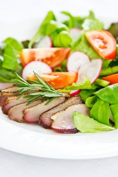 Smoked duck with lettuce,field salad,tomato and rosemary salad