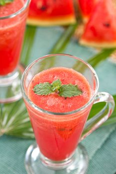 Watermelon smoothie  in glasses by some fresh watermelon