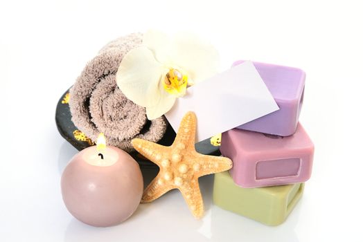 Spa and wellness setting with natural soap, starfish and towel. Beige dayspa