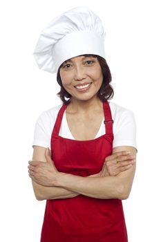 Smiling portrait of confident asian chef. Posing with arms folded