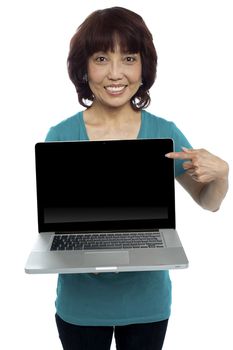 Saleswoman presenting you brand new laptop. All on white background
