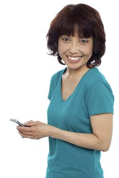 Pretty girl messaging her friends while looking at you