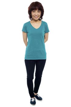 Full length casual portrait of beautiful asian woman isolated on white