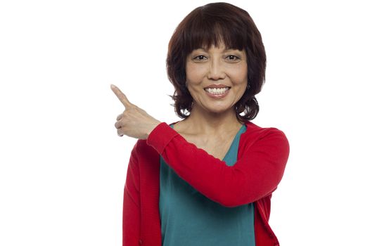 Beautiful woman indication copy space area isolated against white