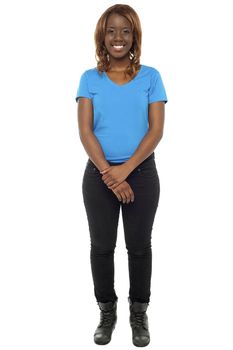 Young african girl posing in casuals and wearing boots. Full length shot