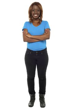 Full length shot of gorgeous african teenager posing with her arms crossed