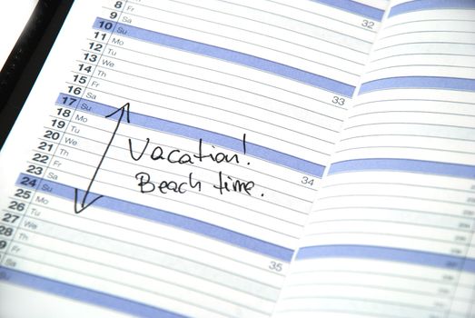 daily planner showing scheduled vacation time at the beach