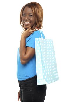 Satisfied lady shopper with shopping bag isolated on white background