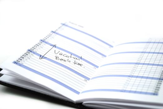 daily planner showing scheduled vacation time at the beach