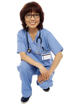 Female surgeon semi seated on floor. Studio shot. Isolated on white