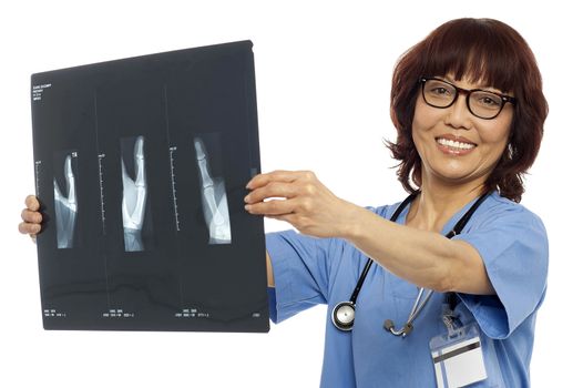 Doctor holding x-ray report. Analyzing it. All on white background