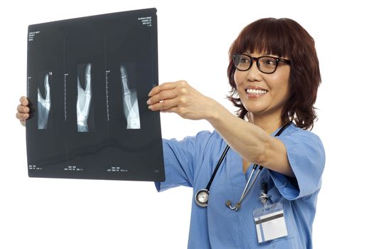 Female doctor reviewing x-ray report of her patient. Indoor shot