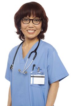 Pleasing matured asian female gynecologist with stethoscope around her neck