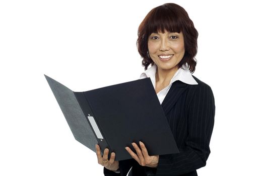 Young female asian boss going through the file isolated against white background