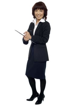 Secretary ready to take down notes from boss. Full length shot
