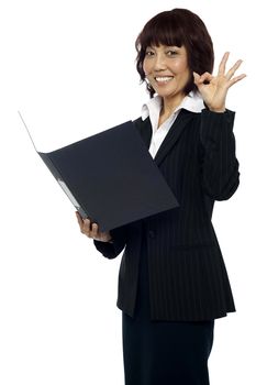 Lady consultant satisfied with the report, gesturing okay sign