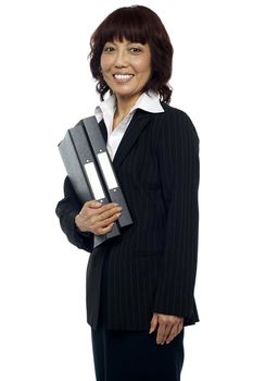Smiling businesswoman holding her file folder isolated against white background
