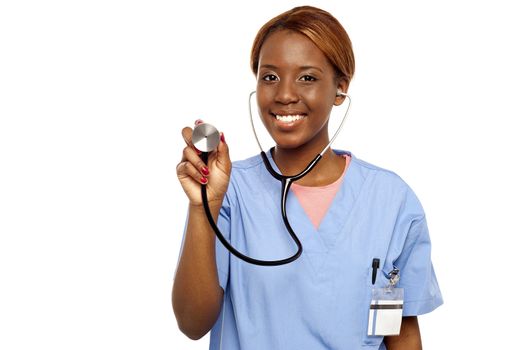 Nurse ready to examine your heartbeat. Holding stethoscope