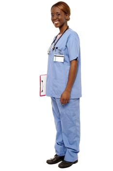 Medical expert holding clipboard, full length shot over white background