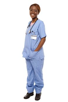 Medical expert posing with hands in her uniform isolated over white background