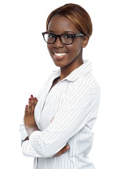 Smiling african lady consultant posing with arms crossed. Closeup shot