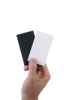 Businessman's hand holding blank and black paper business card