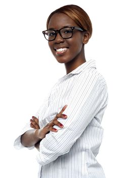 Side view of confident corporate lady posing in style with her arms crossed