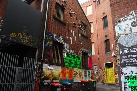 Posters on walls of Melbourne city street, Australia